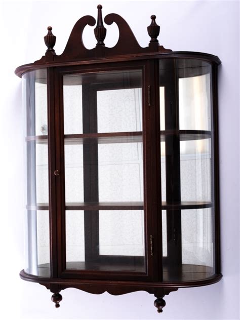 Curio cabinets have always incited, well, curiosity—what objects justify placement in a curio? Mahogany Wall Mount Curio Cabinet