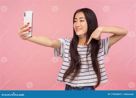 Portrait Of Charming Asian Girl With Brunette Hair Taking Selfie On Mobile Phone Communicating