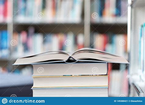 Open Book On A Stack Of Books In A Library Stock Image Image Of
