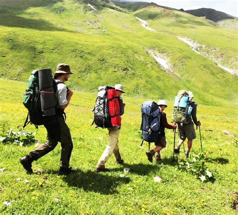 People In Hike In Caucasus Mountains Sponsored Sponsored
