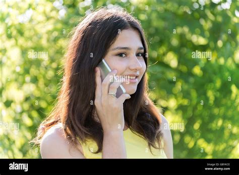 Cute Girl Talking On Phone In Park Stock Photo Alamy
