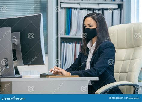 Young Serious Secretary Looking At Computer Screen During Network Stock