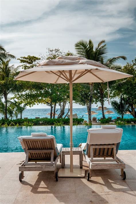 Mahe Seychelles Luxury Swimming Pool With Chairs At The Four Season