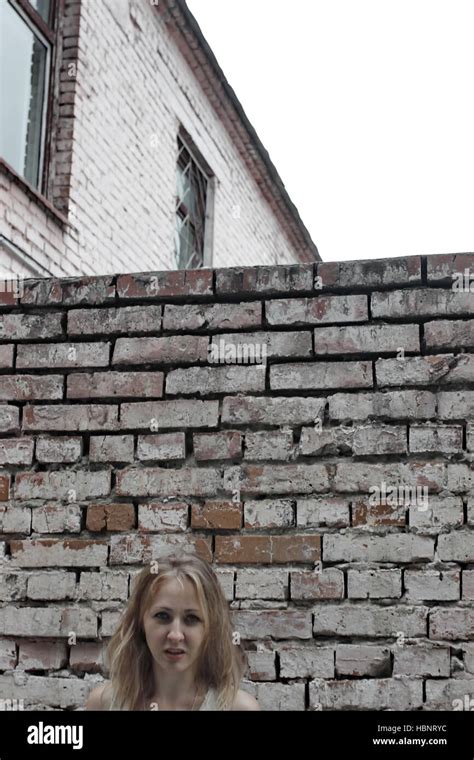 Girl Brick Wall Stock Photo Alamy