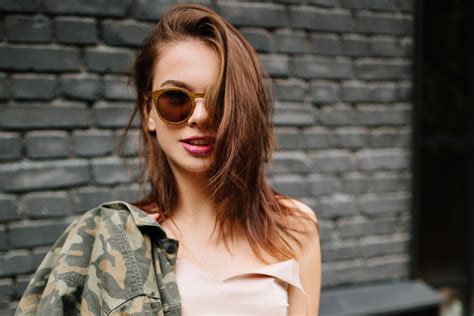 The thin hair is styled in layers that descend in waves, with the side parting making an elegant frame for the forehead. Ghost Layers Hair Cut - NewBeauty