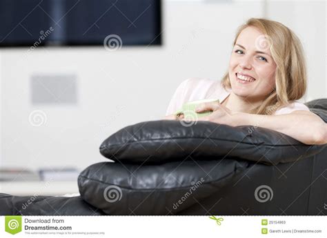 Woman Enjoying Drink On Sofa Stock Image Image Of Cheerful Home