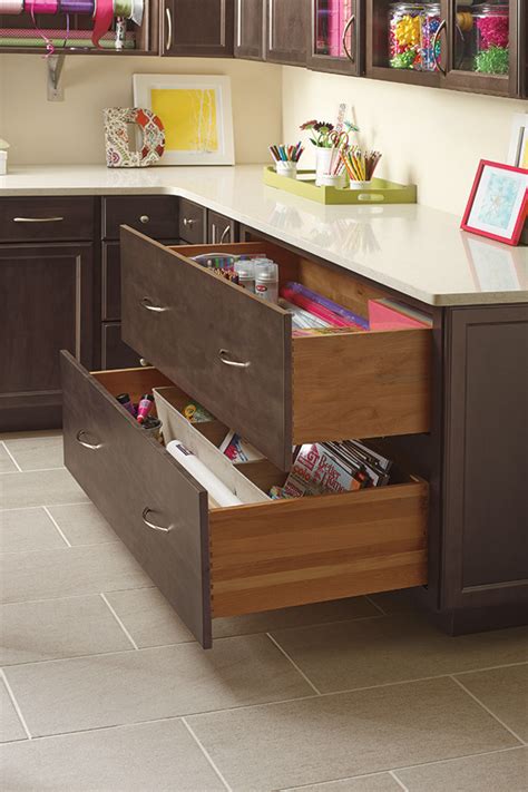 Line up the plastic piece that goes onto the outside of the drawer itself. Two Drawer Base Cabinet - Diamond Cabinetry