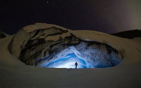Ice Climber At The Entrance To An Ice Cave Athabasca Glacier Alberta