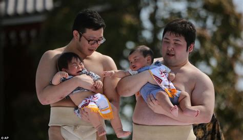 Sumo Wrestlers Try To Make Babies Cry In Bizarre Contest During Nakizumo Festival Daily Mail