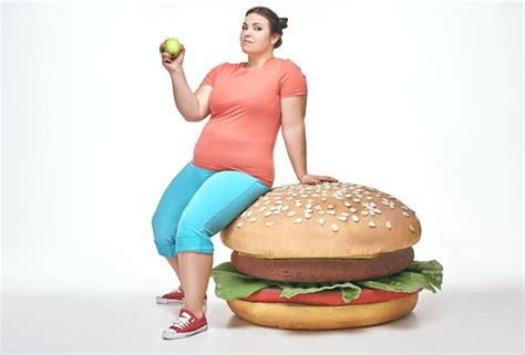 Premium Photo Brunette Funny Plump Woman Sits On A Huge Sandwich