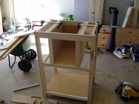 Using A Pocket Hole Jig To Attach The Lower Rails Of The Cabinet