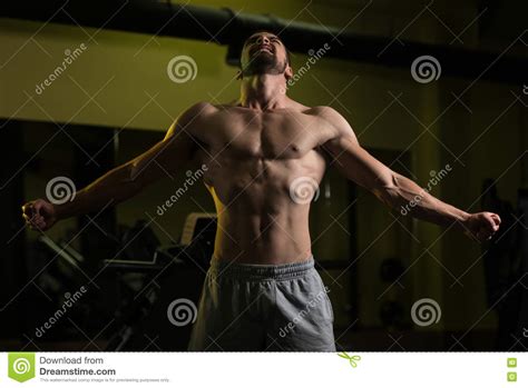 Healthy Young Man Flexing Muscles Stock Photo Image Of Athlete
