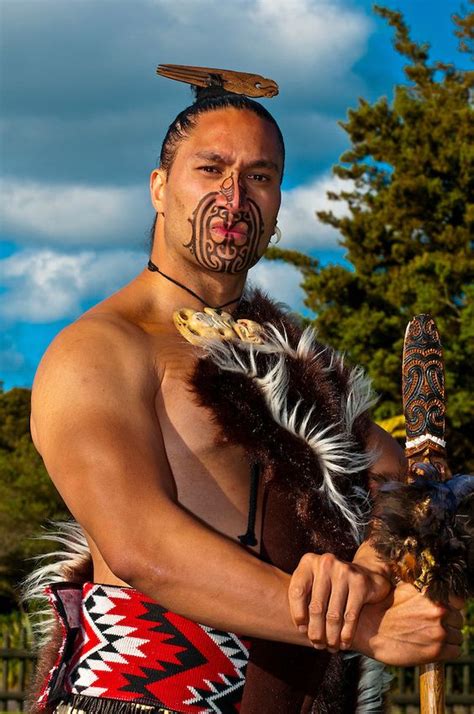 A Maori Warrior With A Ta Moko Facial Tattoo Performs A War Haka