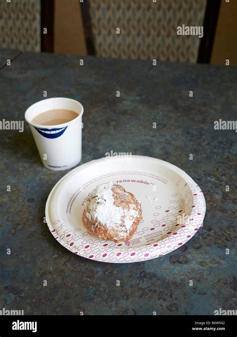 Beignet And Coffee A New Orleans Favorite At A Breakfast Table In The
