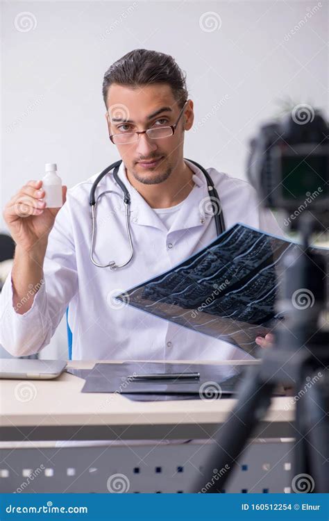 Young Male Doctor Radiologist Recording Video For His Blog Stock Photo