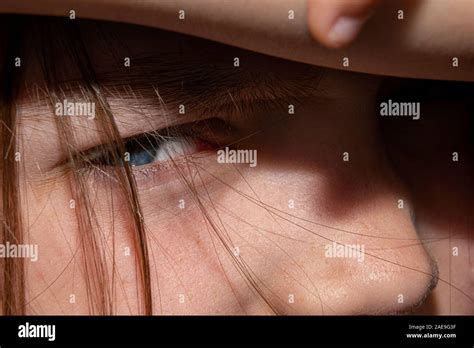 Close Up Of A Baby Girls Face A Child Covering His Eyes From The