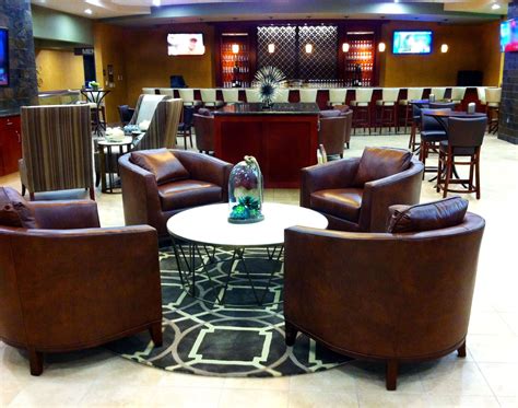 Bar Area With Custom Rug Seating Bar Stools Leather Lounge Chairs