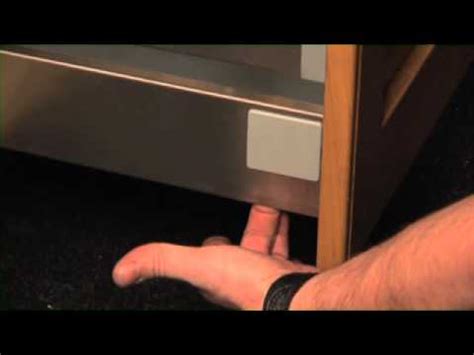 Place support blocks under the wall cabinet you're working on. Cooke & Lewis - Removing Fitted Drawers - YouTube