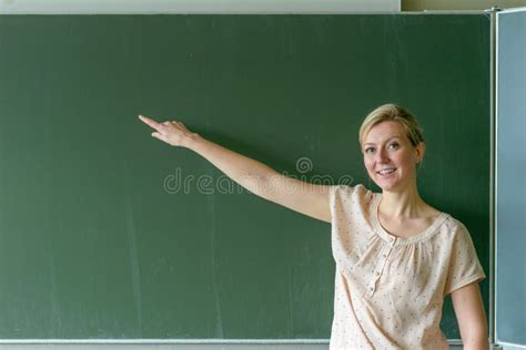 Teacher Pointing At Copy Space Place On Chalkboard Stock Image Image Of Female Blackboard