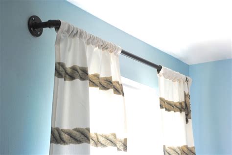 I've seen it done before, but i was worried that the weight of the curtains would eventually make the pvc bow or sag. DIY Industrial Pipe Curtain Rods {Boys Room Update ...