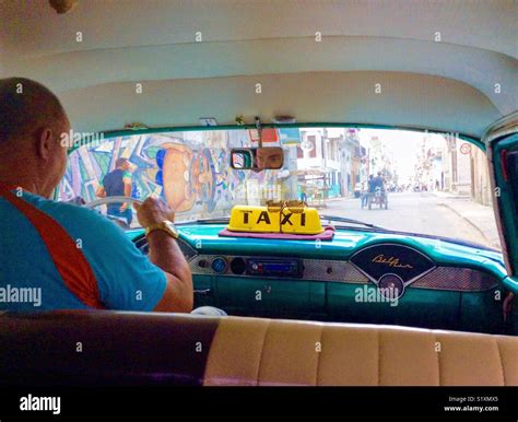 Cuban Taxi Driver Navigating The Streets Of Havana Stock Photo Alamy