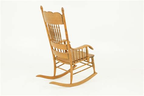 Antique Rocking Chair Spindle Pressed Back Carved Oak America 1910