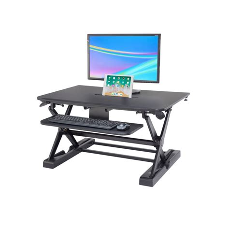 Rectangular gray standing desk with adjustable height feature. Sit-Stand Desk Converter - Dynamically Height Adjustable Black