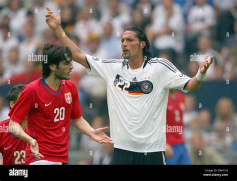 Kevin Kuranyi striker of Germany's national soccer squad (R) gestures