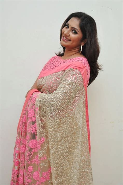 Tv Anchor Jhansi Photos In Pink Transparent Netted Designer Saree