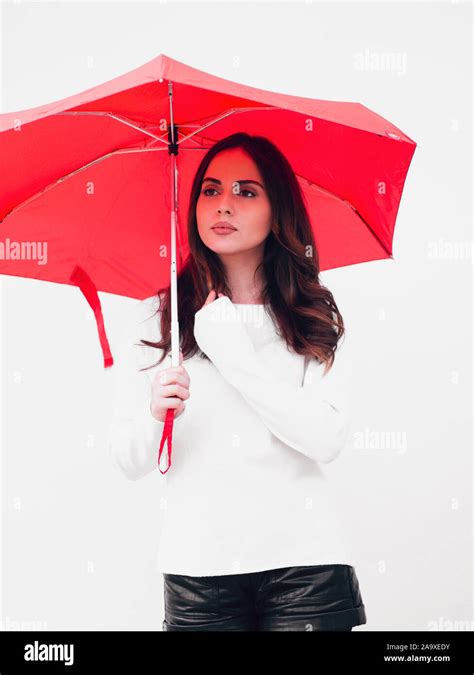 Beautiful Young Woman Holding A Red Umbrella Stock Photo Alamy