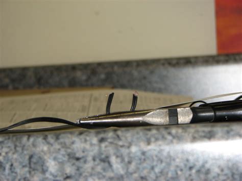 If the wire was coated with an enamel, it then makes sense to simply burn off the insulation and you should end up with bare wire underneath. Easy Headphone Repair for Broken Wires: 7 Steps