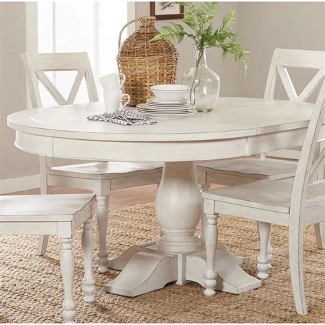 Round pedestal tables with leaves are a versatile way to anchor the room. Ophelia & Co. Eminence Extendable Dining Table & Reviews ...