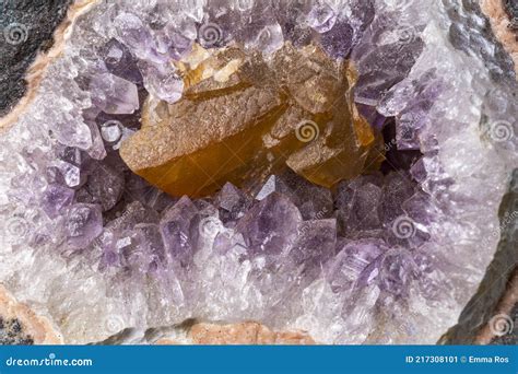 Details Of An Amethyst Geode With An Embedded Piece Of Brownish Quartz