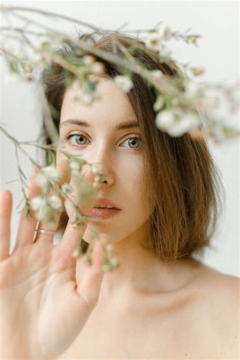 Woman Holding White Flowers · Free Stock Photo