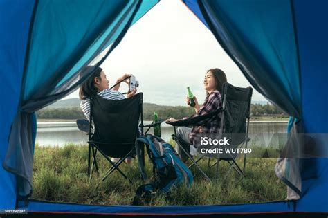 Asian Lgbtq Couples Drinking Drinks In A Romantic Atmosphere Inside A Camping Tent Lgbtq Couples