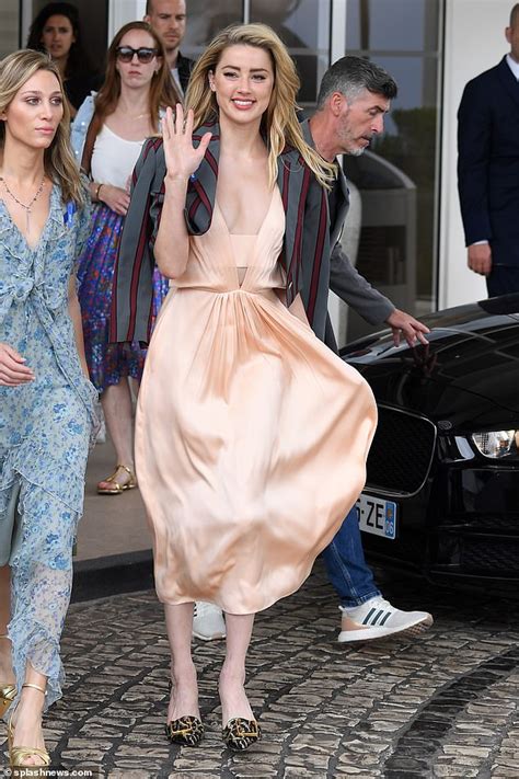 Amber Heard Goes Braless In Very Daring Plunging Dress As She Steps Out During Cannes Film