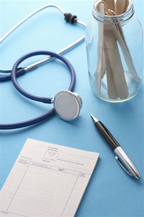 Stethoscope Pen Notepad And Jar Of Sticks On Doctors Table Stock Image Image Of Wooden