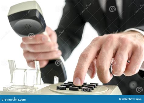 Businessman Hand Dialing A Phone Number Royalty Free Stock Images