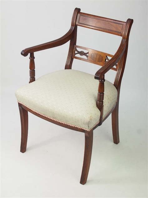 The bergère chair in the showrooms of reindeer antiques is a fine example of a regency armchair. Antique Regency Mahogany Desk Chair / Open Armchair