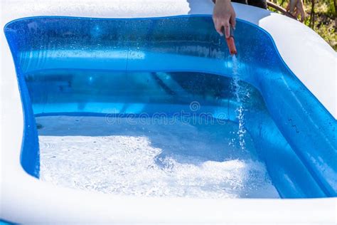 Little Boy Filling Filling Swimming Pool With Water Stock Image Image