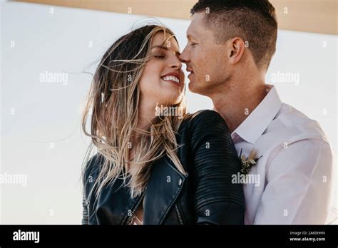 Affectionate Bride And Groom Kissing Outdoors Stock Photo Alamy