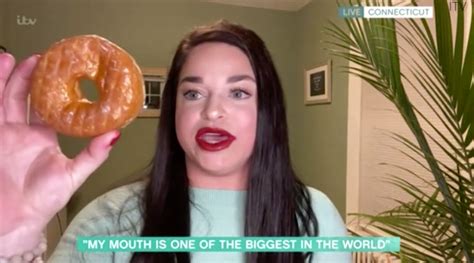 Woman Stuns By Cramming Two Whole Doughnuts In Huge Mouth