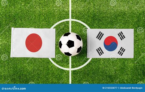 Top View Ball With Japan Vs South Korea Flags Match On Green Football