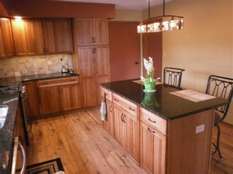 Our kitchen is on the small side, (long and narrow.)so we are installing a 10x 12.3 l shaped kitchen. Kraftmaid Cabinets - Top Notch Building Supply