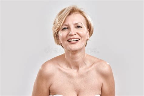 Portrait Of Beautiful Middle Aged Woman Smiling At Camera Posing