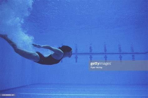 Woman Diving Into Swimming Pool Underwater View Photo Getty Images