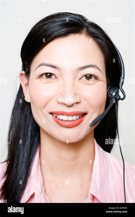 Portrait Of A Female Customer Service Representative Using A Headset