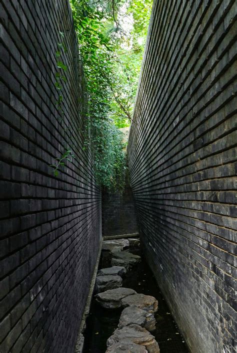 dong yugan uses brick to form sculptural surfaces at beijing art museum