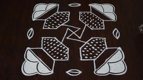 This is a pongal special kolam design drawn with flowers and deepams with 13 dots explained in a simple step by step video. sankranti pot designs - pongal pot kolangal - simple pongal pot kolam - pongal pot kolam designs ...