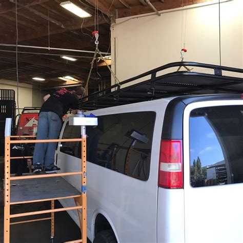 Chevy Van Getting A Roof Rack Installed At Aluminess Chevy Van Van